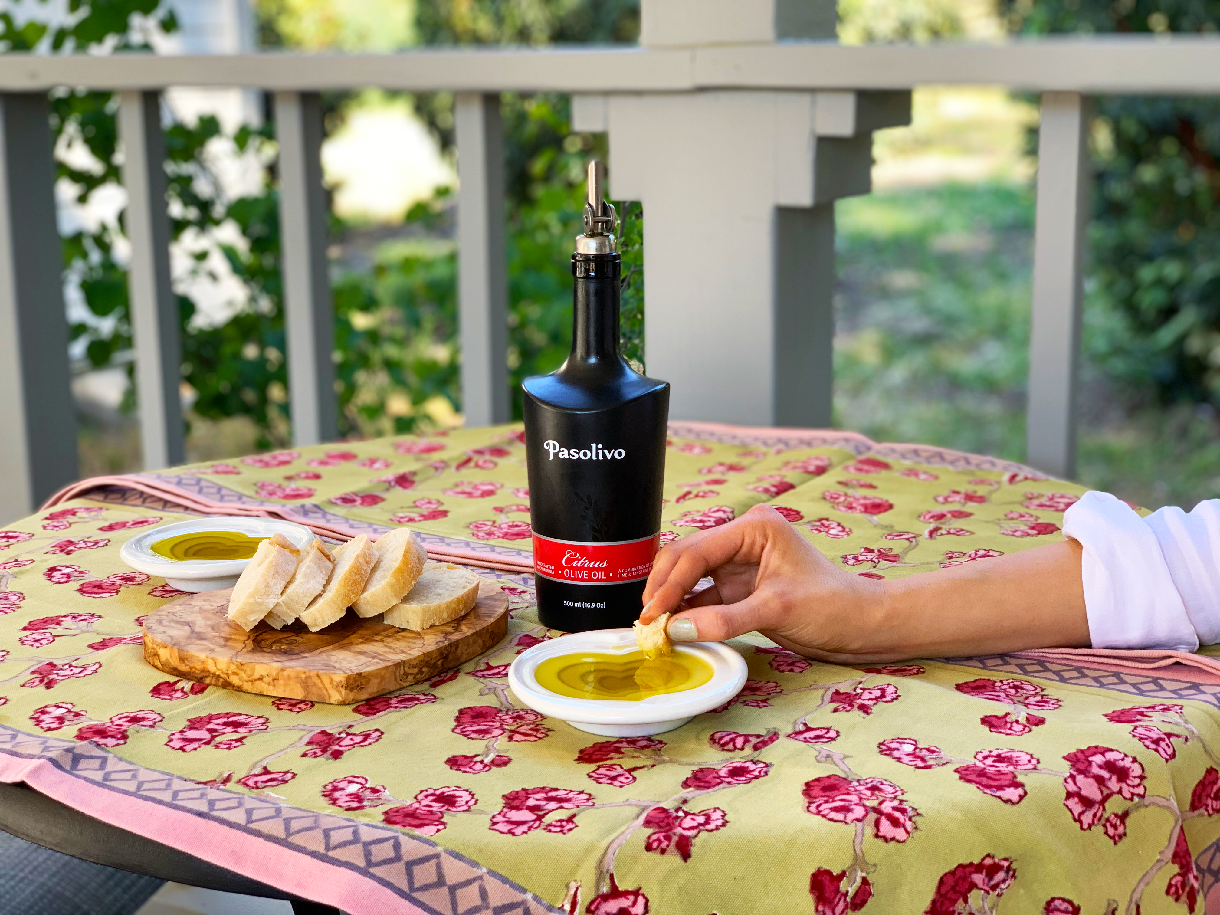 Dipping bread in Pasolivo Citrus Olive Oil